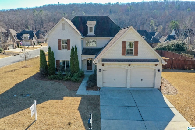 view of front of house featuring a front yard and a garage