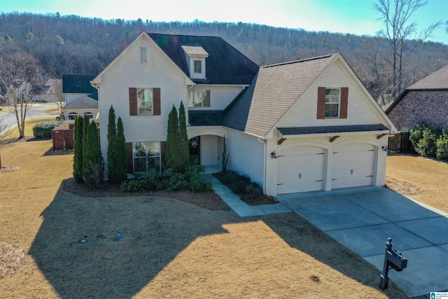 view of front of home with a garage and a front yard