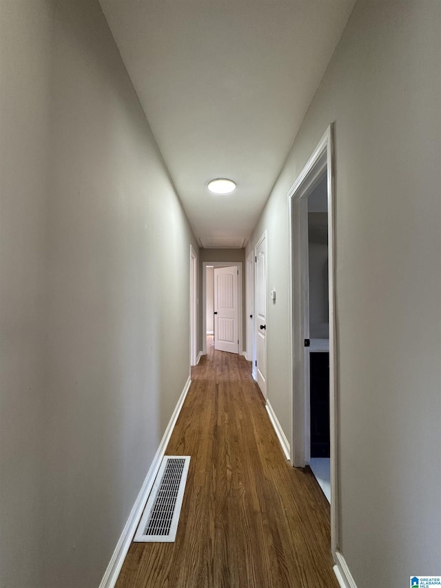 hallway featuring dark hardwood / wood-style floors