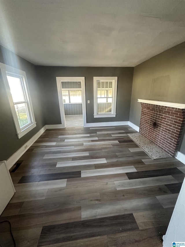 unfurnished living room featuring hardwood / wood-style floors