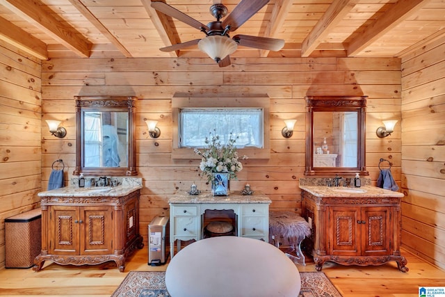 bathroom featuring wood walls, hardwood / wood-style floors, beamed ceiling, and wood ceiling