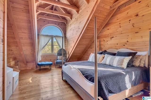 bedroom featuring vaulted ceiling with beams, wood walls, wood ceiling, and light hardwood / wood-style flooring