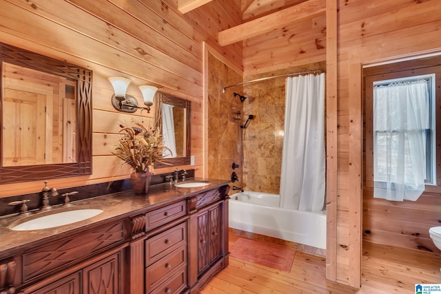 full bathroom featuring beam ceiling, wooden ceiling, wood walls, shower / bath combo with shower curtain, and vanity