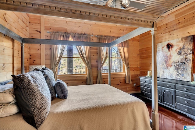 bedroom with wood walls, dark hardwood / wood-style flooring, and wood ceiling