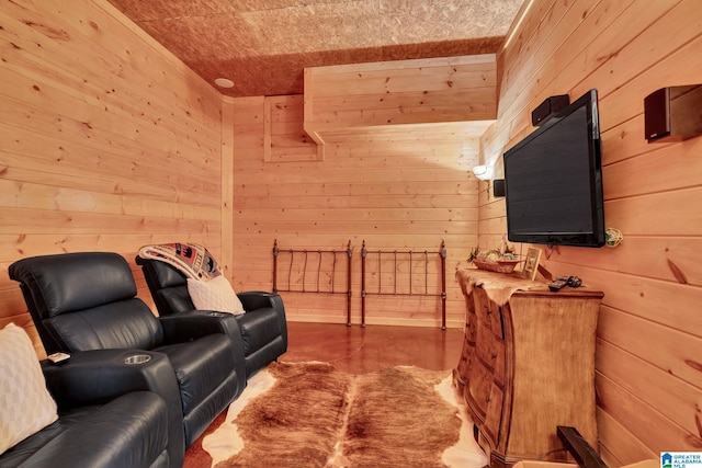 living room featuring wood walls, wooden ceiling, and concrete flooring