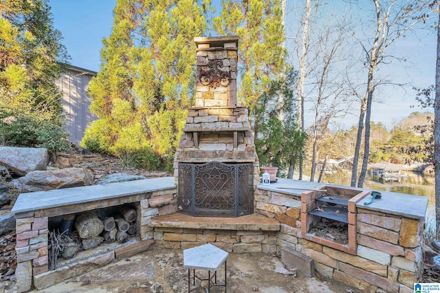 view of patio / terrace with an outdoor stone fireplace