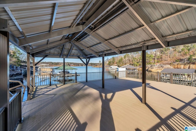 exterior space featuring a gazebo, a boat dock, and a water view