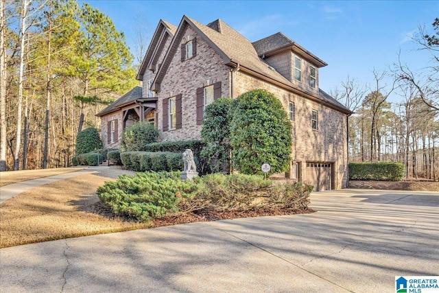 view of side of home with a garage