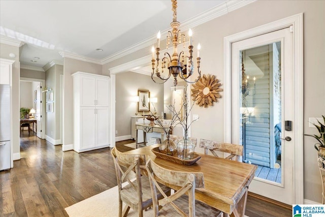 dining space with dark hardwood / wood-style floors, crown molding, and a notable chandelier