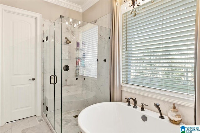 bathroom with a notable chandelier, crown molding, and shower with separate bathtub