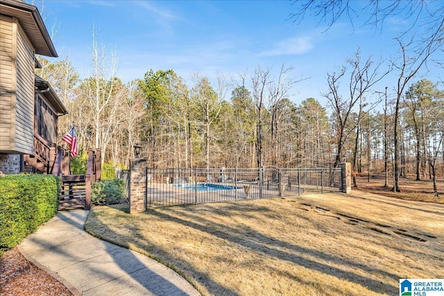 view of yard with a fenced in pool