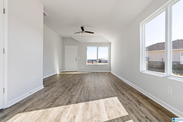 unfurnished living room with baseboards, a ceiling fan, and wood finished floors