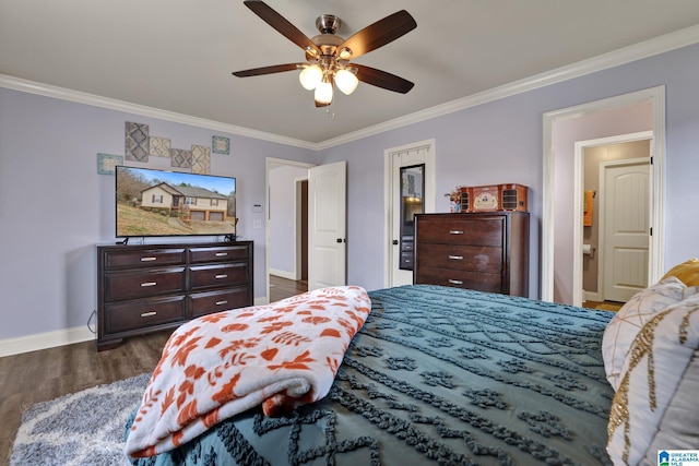 bedroom featuring ceiling fan, dark hardwood / wood-style floors, ornamental molding, and connected bathroom