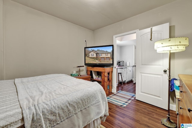 bedroom featuring dark wood-type flooring