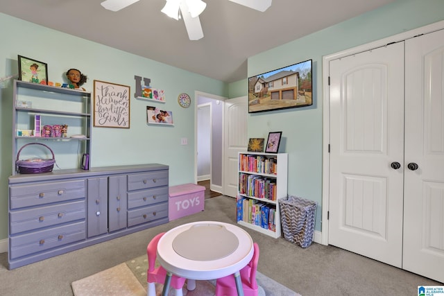 game room with carpet flooring and ceiling fan