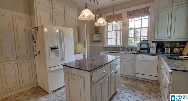 kitchen with sink, hanging light fixtures, light tile patterned floors, white appliances, and a kitchen island