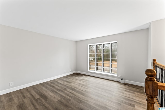 unfurnished room featuring hardwood / wood-style flooring