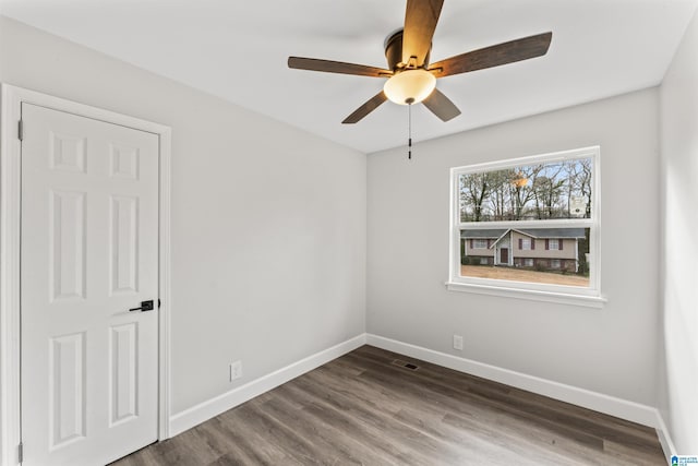 spare room featuring hardwood / wood-style flooring and ceiling fan