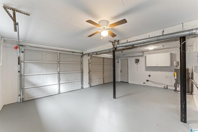 garage featuring gas water heater and ceiling fan