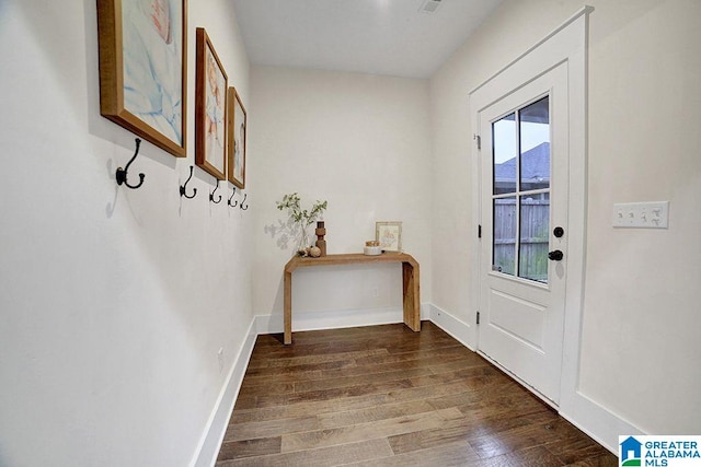 doorway with dark hardwood / wood-style flooring