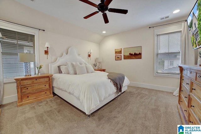 carpeted bedroom with ceiling fan and lofted ceiling