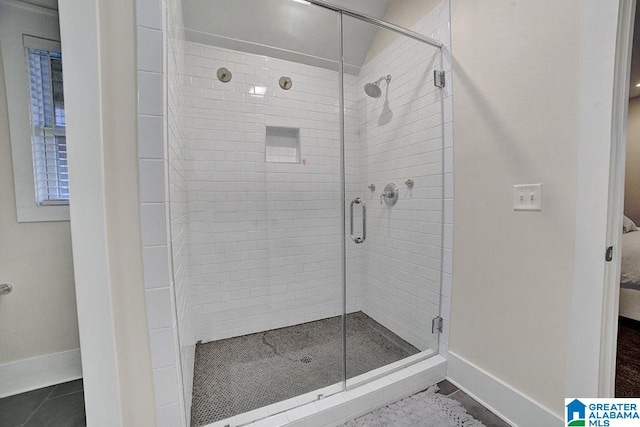 bathroom featuring tile patterned floors and walk in shower