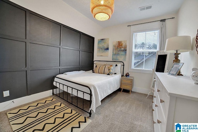 bedroom featuring light colored carpet