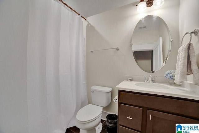 bathroom with vanity and toilet