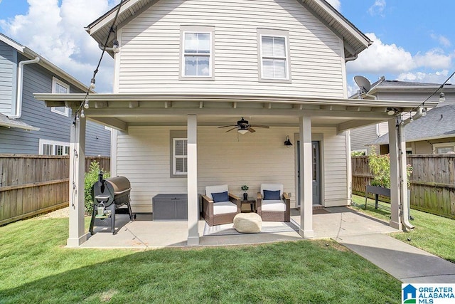 back of property featuring a yard, an outdoor hangout area, ceiling fan, and a patio area