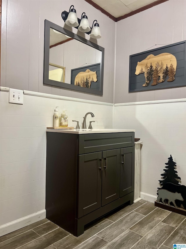 bathroom with vanity and ornamental molding