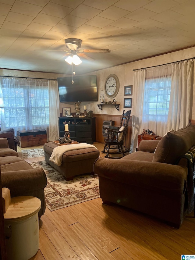 living room with ceiling fan and hardwood / wood-style floors