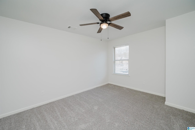 carpeted empty room featuring ceiling fan