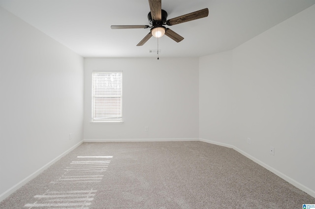 empty room featuring ceiling fan and carpet floors