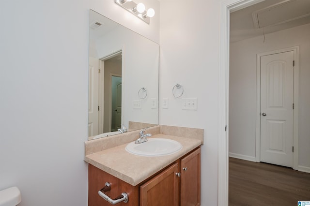 bathroom featuring hardwood / wood-style flooring and vanity