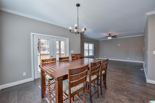 dining room featuring ceiling fan with notable chandelier, a healthy amount of sunlight, and crown molding