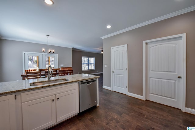 kitchen with light stone counters, stainless steel dishwasher, sink, pendant lighting, and white cabinets