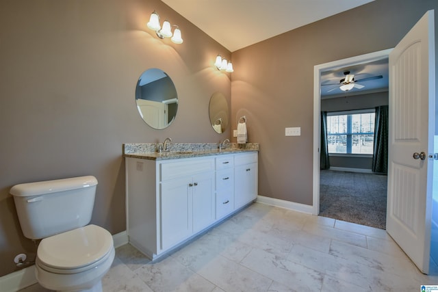 bathroom with ceiling fan, vanity, and toilet