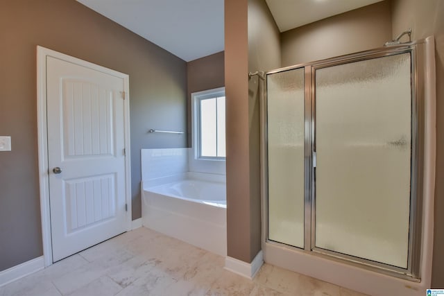 bathroom featuring tile patterned flooring and shower with separate bathtub