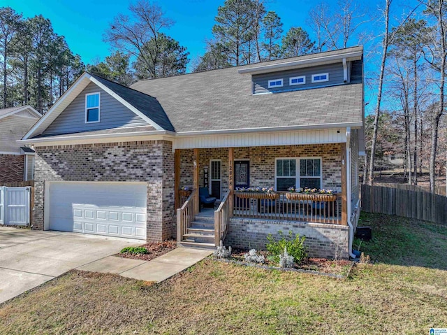 view of front of property with covered porch and a front yard