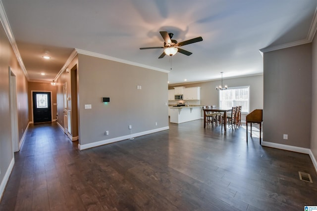 unfurnished living room with ceiling fan with notable chandelier, dark hardwood / wood-style floors, and ornamental molding