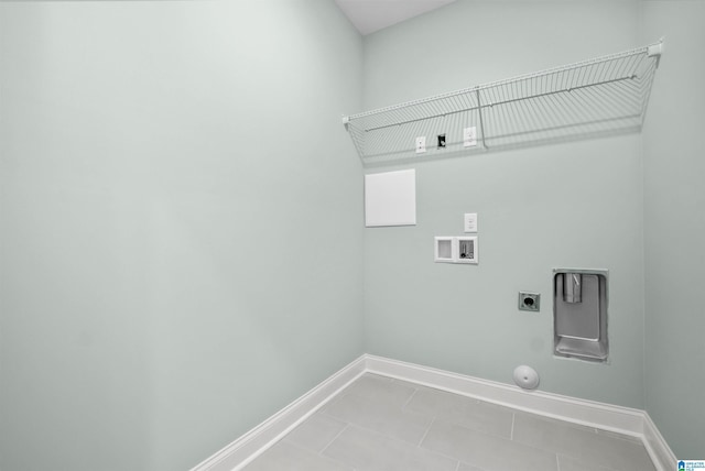 laundry room featuring gas dryer hookup, washer hookup, hookup for an electric dryer, and light tile patterned flooring