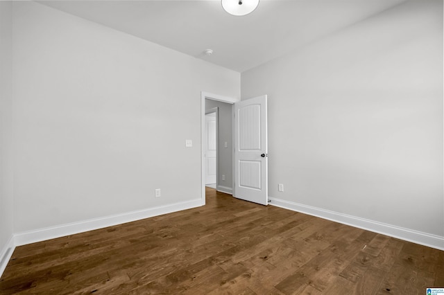 empty room featuring wood-type flooring