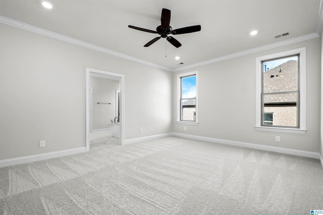 carpeted empty room featuring crown molding and ceiling fan