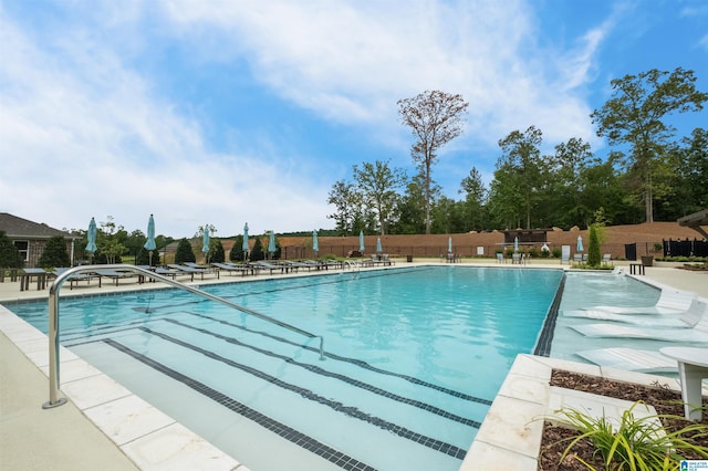 view of swimming pool with a patio