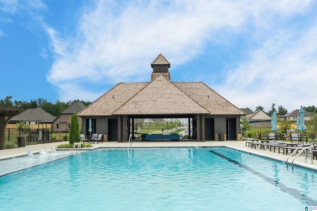 view of pool featuring a gazebo and a patio