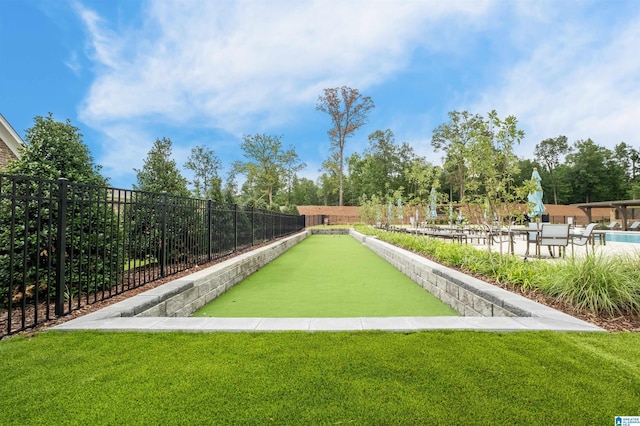 view of property's community with a lawn