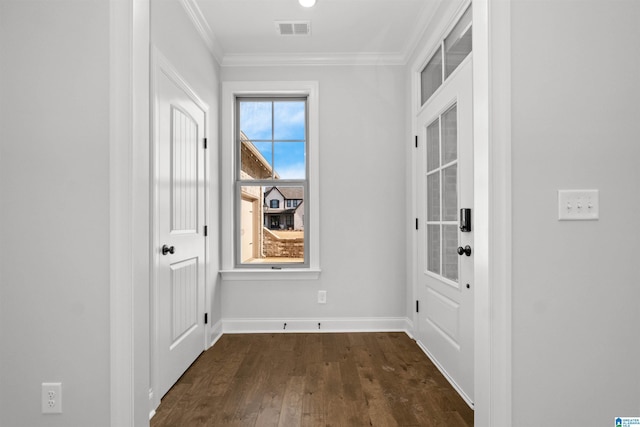 doorway featuring crown molding and dark wood-type flooring