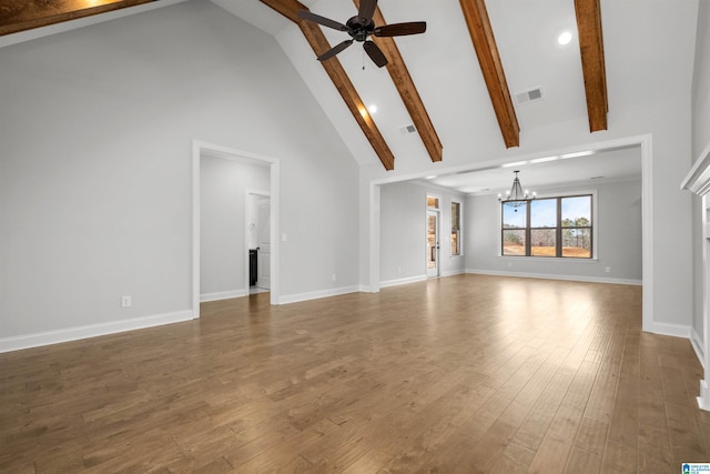 unfurnished living room featuring beamed ceiling, dark hardwood / wood-style floors, ceiling fan with notable chandelier, and high vaulted ceiling