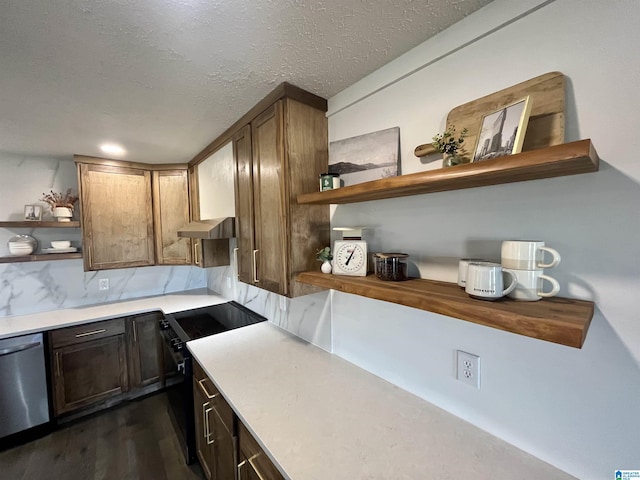 kitchen featuring black electric range oven, dark wood-type flooring, exhaust hood, stainless steel dishwasher, and a textured ceiling