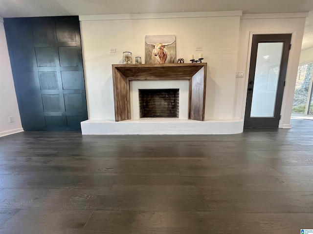 unfurnished living room featuring crown molding and dark hardwood / wood-style floors